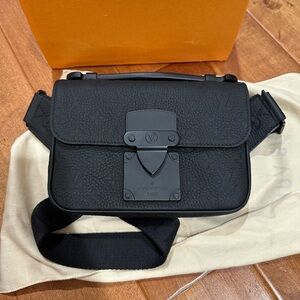 SOLD. Louis Vuitton S lock sling bag bumbag